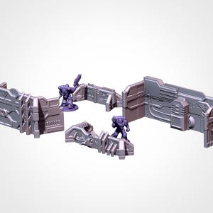 May include: A set of gray and purple miniature sci-fi terrain pieces, including walls and barriers. Two purple figures are positioned within the terrain, suggesting a battle scene. The pieces have detailed mechanical designs.