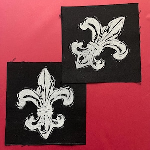 Gotiskt Fleur De Lis-tygmärke