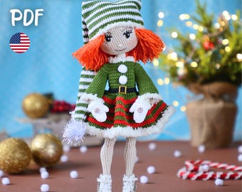 May include: A handmade crochet doll in an elf costume. The doll has red hair, a green and white striped hat, a green jacket, and a red and white striped skirt. The doll is wearing white boots and gloves. The image includes the text "PATTERN PDF" and an American flag.