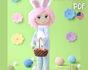 May include: A crocheted doll wearing a blue bunny costume with pink hair and bunny ears, holding a basket. The doll is surrounded by crocheted Easter eggs and flowers. The image includes the text "PATTERN PDF" and an American flag.