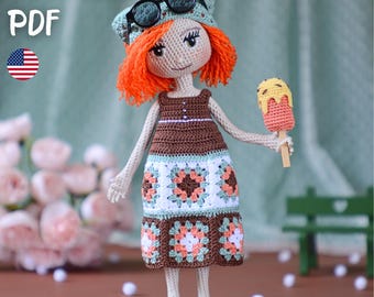 May include: A handmade crochet doll with orange hair, wearing a brown and white dress, green sandals, and sunglasses on her head. The doll is holding a crochet popsicle. The image includes the text "PATTERN PDF" and a US flag.