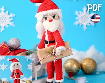 May include: A crocheted Santa Claus doll wearing a red suit with white trim, a black belt, and a matching hat. The doll has a white beard and is holding a wrapped gift. The background is blue with snowflake decorations.