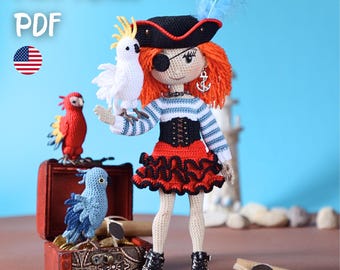 May include: Crocheted pirate doll with red hair, a black hat, and an eye patch, holding a white parrot. The doll wears a striped shirt, red skirt, and black boots. A red treasure chest with blue and red parrots is in the foreground. The text "PATTERN PDF" is in the top left corner.