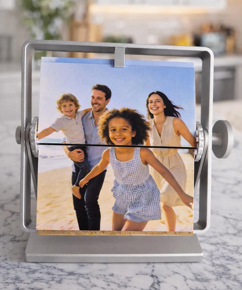 Thoughtful gift mom: Silver rotating metal photo display showing a family beach picture. Personalized freestanding desk frame.