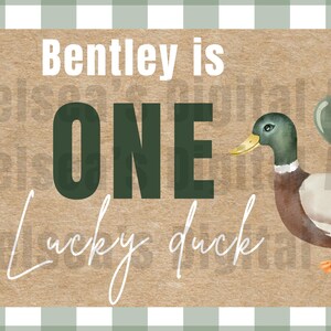 May include: A digital design featuring a duck illustration with balloons, cattails, and the text "Bentley is ONE Lucky duck" on a textured background. The design has a green and white checkered border.
