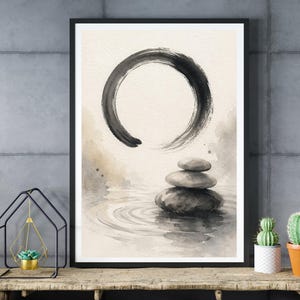 May include: Framed watercolor art print featuring a black Zen circle above a stack of gray stones in water. The artwork has a minimalist style with soft, neutral tones, creating a sense of peace and tranquility. The print is framed in a black border.