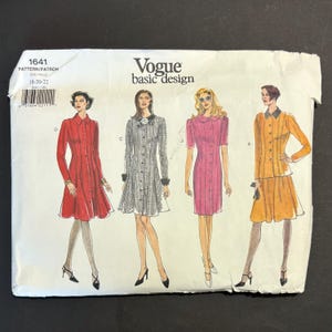 May include: A Vogue basic design sewing pattern envelope 1641, size 18-20-22, featuring illustrations of four different dress styles. The designs include a red long-sleeve dress, a black and white patterned dress, a pink short-sleeve dress, and an orange two-piece set.