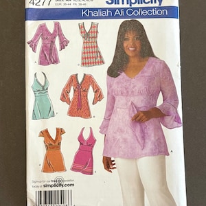 May include: Simplicity sewing pattern featuring the Khaliah Ali Collection. The pattern includes designs for various tops and dresses in shades of pink, orange, and teal. The front of the pattern shows a woman wearing a pink top. The pattern size is AA 10, 12, 14, 16, 18.