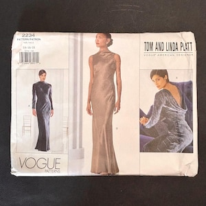 May include: A Vogue Patterns sewing pattern envelope for Tom and Linda Platt design 2234, sizes 14-16-18. The white envelope features illustrations of a floor-length sleeveless gown and a long-sleeved gown with a low back, both in a metallic fabric.