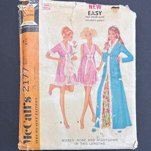 May include: Vintage McCall's 2177 sewing pattern for misses' robes and nightgowns in two lengths. The pattern envelope is orange and white, with illustrations of the garments in pink and blue. The text "NEW EASY" is visible.