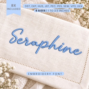May include: An embroidery font design featuring the name Seraphine stitched in blue thread on a light beige linen fabric. The image includes text indicating BX included, file formats DST, EXP, HUS, JEF, PEC, PES, SEW, VP3, XXX, and 6 sizes from 2.5 to 8.9 cm.