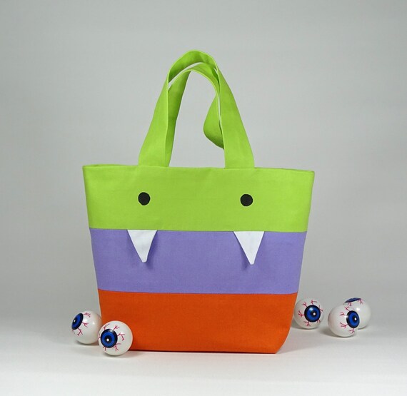 image 0 image 1 image 2 image 3 image 4 image 5 image 6 🔎zoom Request a custom order and have something made just for you. Halloween trick or treat bag monster tote bag