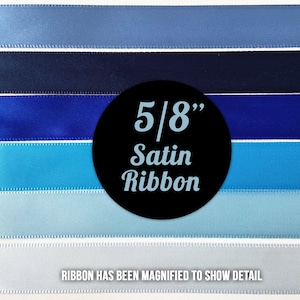 May include: A close-up of six different shades of blue satin ribbon, each 5/8 inch wide. The ribbon is arranged in a horizontal stack, with the darkest blue at the top and the lightest blue at the bottom. The text "5/8" Satin Ribbon" is visible in a black circle in the centre of the image.