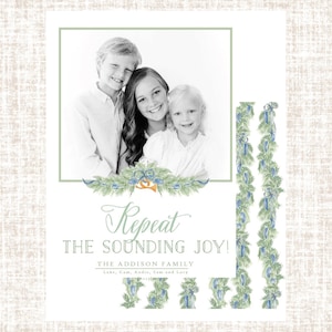 May include: A holiday card with a black and white family photo framed in green. The text "Repeat the Sounding Joy!" is written in elegant script. Decorative green and blue floral elements are present.