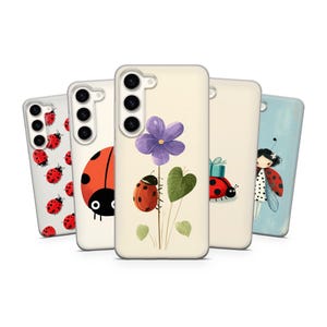 May include: A collection of phone cases with various designs. The cases feature illustrations of ladybugs, flowers, and a girl with ladybug wings. The color palette includes red, black, white, green, and purple.