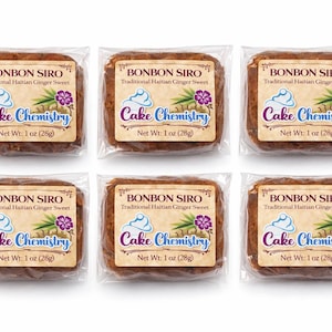 May include: Six individually wrapped Bonbon Siro, a traditional Haitian ginger sweet, each with a label featuring the text "Cake Chemistry." Each sweet weighs 28g. The labels include a graphic of a cupcake, ginger, and a purple flower.