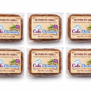 May include: Six individually wrapped Bonbon Siro, a traditional Haitian ginger sweet, each with a label featuring the text "Cake Chemistry." Each sweet weighs 28g. The labels include a graphic of a cupcake, ginger, and a purple flower.