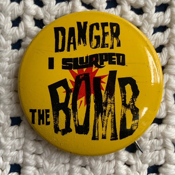 Vintage 7-11 Slurpee Tin Litho Pinback - Danger I slurped the Bomb