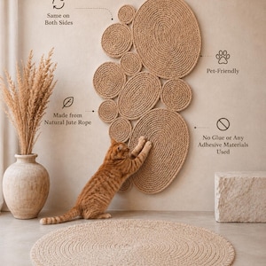 May include: A wall-mounted cat scratching post made of natural jute rope in a cluster of circular and oval shapes. Text labels indicate: Same on Both Sides, Pet-Friendly, Made from Natural Jute Rope, and No Glue or Any Adhesive Materials Used.