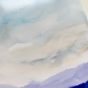 May include: A watercolor painting of a sky with clouds in shades of blue, gray, and white. The bottom of the painting is a gradient of purple and blue.