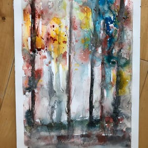 May include: Watercolor painting of a forest scene with tall, slender trees. The artwork features a palette of warm colors, including yellow, orange, and red, contrasted with cool blues and greens. The painting has a soft, ethereal quality.