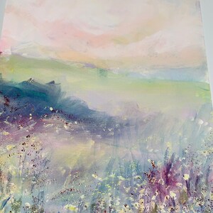 May include: A painting of a landscape with a soft, hazy sky in shades of pink and white. The foreground features a field of white flowers with purple and green accents. The painting has a dreamy, ethereal feel.