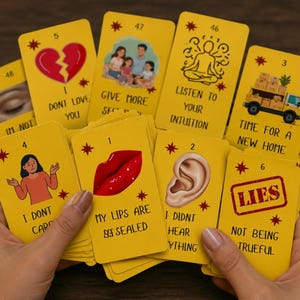 May include: A deck of yellow oracle cards featuring various illustrations and text including I DONT LOVE YOU, GIVE MORE SELF LOVE, LISTEN TO YOUR INTUITION, TIME FOR A NEW HOME, I DONT CARE, MY LIPS ARE SEALED, I DIDNT HEAR ANYTHING, and LIES NOT BEING TRUEFUL.