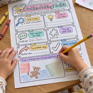 May include: A printed worksheet titled My Problem-Solving Toolkit with sections for Look closely, Think of two ideas, Ask someone for help, Try one small step, Try another way, and a space to draw a challenge and a tool with a crayon drawing of a bear.