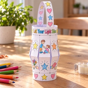 May include: A paper lantern craft featuring the text Let Your Light Shine, decorated with colorful illustrations of children, stars, hearts, and flowers. The lantern has a white handle and is constructed from paper with vertical slits.