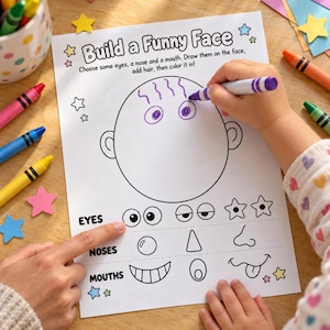 Pode incluir: Uma folha de atividades branca intitulada Build a Funny Face com o contorno de uma cabeça circular grande e vazia, instruções e várias opções de desenhos de linha para olhos, narizes e bocas, rodeada por lápis de cor e estrelas de papel.