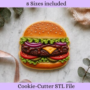 May include: A hamburger-shaped cookie cutter STL file featuring a detailed design with a sesame seed bun, green lettuce, purple onion rings, brown patty, yellow cheese, red tomato slices, and green pickles. The text 8 Sizes included is visible.