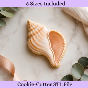 May include: A seashell-shaped cookie with light peach and cream-colored icing, featuring a spiral design and a textured interior. The text 8 Sizes Included and Cookie-Cutter STL File is displayed at the top and bottom of the image respectively.