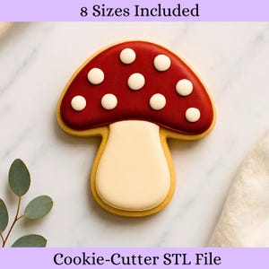 May include: A mushroom-shaped cookie cutter with a red top and white dots, and a beige stem. The cookie cutter is outlined in a golden-brown color. Text at the top reads "8 Sizes Included" and at the bottom "Cookie-Cutter STL File".