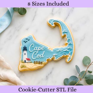 May include: A Cape Cod cookie cutter shaped like the Cape Cod peninsula. The cookie is decorated with blue icing, a lighthouse, and the words "Cape Cod". The image also includes the text "8 Sizes Included" and "Cookie-Cutter STL File".