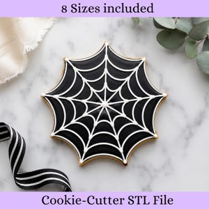 May include: A spider web shaped cookie cutter STL file, featuring a black cookie with white icing web detailing. The text 8 Sizes included and Cookie-Cutter STL File is visible. This digital file is designed for creating spider web cookies.