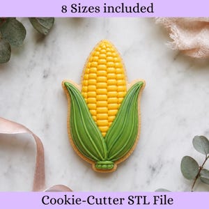 May include: A corn-shaped cookie cutter with a detailed design featuring a central cob with yellow kernels and green husks on either side. The text 8 Sizes included and Cookie-Cutter STL File is visible at the top and bottom of the image.