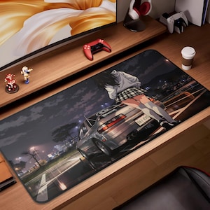 May include: A long, rectangular mousepad featuring an anime-style illustration of a silver sports car at night. A person in a plaid skirt and white top is leaning against the car. The background shows a road and city lights.