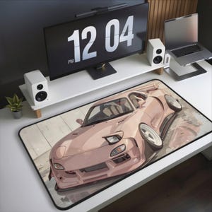 May include: A blush-colored sports car mousepad with a detailed illustration of a modified vehicle. The car features a wide body kit and large white wheels. The mousepad is rectangular with a black border.