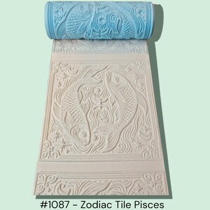 May include: A light blue roller with a detailed fish design is positioned above a rectangular tile with a matching embossed Pisces zodiac pattern. The tile features two fish, water, and star details. The text "#1087 - Zodiac Tile Pisces" is at the bottom.