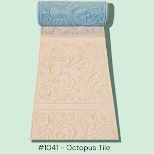 May include: A blue textured roller with an octopus design is shown, rolling over a cream-colored surface. The surface displays an embossed octopus and seashell pattern. The text "#1041 - Octopus Tile" is at the bottom.