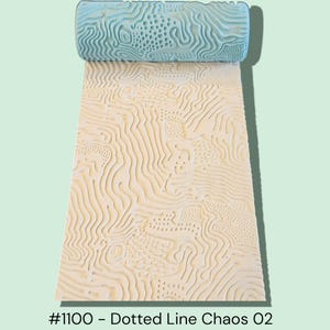 May include: A light blue textured rolling pin with a matching embossed pattern on a cream-coloured surface. The pattern features dotted lines and wavy designs. The text "#1100 - Dotted Line Chaos 02" is visible at the bottom.