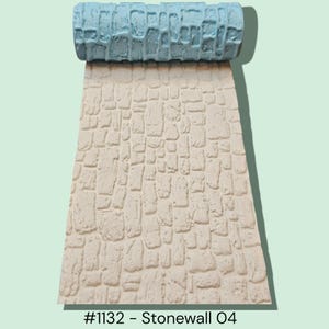 May include: A textured paint roller with a light blue handle is shown above a beige, stone-like pattern. The pattern is made up of irregular, rectangular shapes. The text "#1132 - Stonewall O4" is at the bottom of the image.