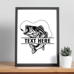 May include: Black framed print featuring a detailed black and white illustration of a largemouth bass with an open mouth, a fishing line, and the text "TEXT HERE" in a bold font. The artwork is set against a white background.