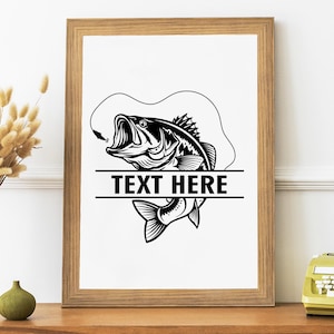 May include: A framed black and white illustration of a largemouth bass with an open mouth, hook, and line. The text "TEXT HERE" is centered below the fish. The artwork is in a wooden frame.