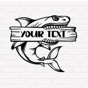 May include: A black and white graphic illustration of a shark biting into a rectangular wooden plank. The plank features the text YOUR TEXT in a bold, black font. The shark is depicted with sharp teeth and detailed line work on its body.