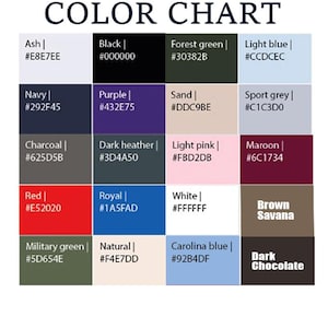 May include: A color chart featuring a grid of twenty rectangular swatches with color names and hex codes. The colors include Ash, Black, Forest green, Light blue, Navy, Purple, Sand, Sport grey, Charcoal, Dark heather, Light pink, Maroon, Red, Royal, White, Brown Savana, Military green, Natural, Carolina blue, and Dark Chocolate.