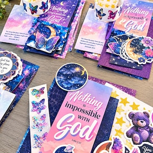 May include: A collection of religious bookmarks and stickers featuring celestial themes, purple and blue gradients, and the text Nothing is impossible with God. Includes die-cut shapes of butterflies, a teddy bear, a dove, and crescent moons.