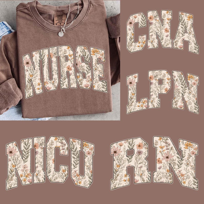 May include: A brown sweatshirt with the word "NURSE" in large, floral-patterned letters. Additional text includes "CNA", "LPN", "NICU", and "RN", also in floral lettering. A silver necklace is visible at the neckline.