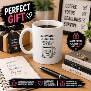 May include: White coffee mug with the text "Surviving Office Life One Coffee At A Time" and a coffee cup graphic. The mug is on a wooden surface with a pen, notepad, and gift box. The image includes the text "Perfect Gift".
