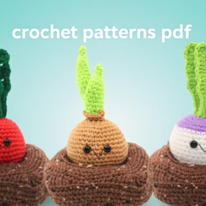 May include: Three crocheted vegetable plushies: a red radish, a tan onion, and a white turnip, each with green tops and smiling faces, nestled in brown soil. The text "crochet patterns pdf" is above the vegetables.